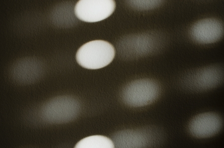 white lights on the wall, symmetrical formsの写真素材