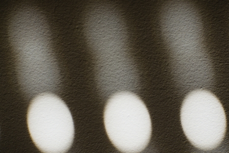white lights on the wall, symmetrical formsの写真素材