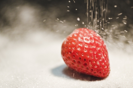 strawberry on a lot of white sugarの写真素材