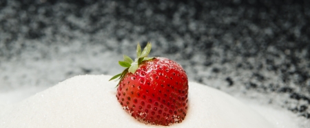 strawberry on a lot of white sugarの写真素材