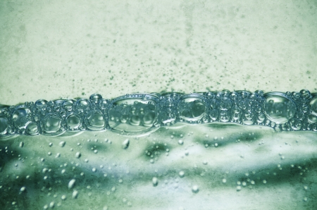 abstract background water bubbles in greenの写真素材