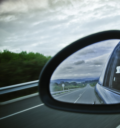 road reflected in the mirror of the carの写真素材