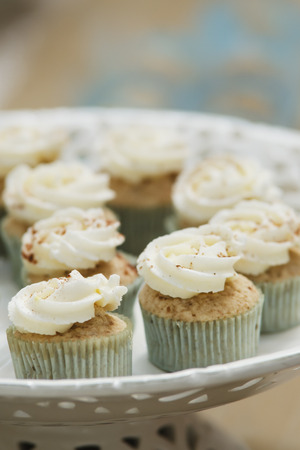A delicious gourmet cinnamon spice cupcake on a plateの写真素材