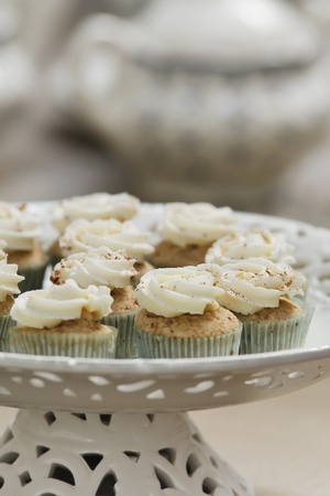 A delicious gourmet cinnamon spice cupcake on a plateの写真素材