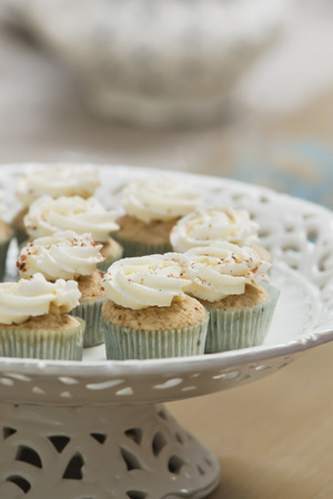 A delicious gourmet cinnamon spice cupcake on a plateの写真素材