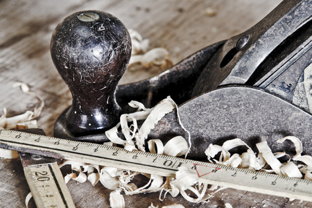 Old carpentry tools on a wooden tableの写真素材