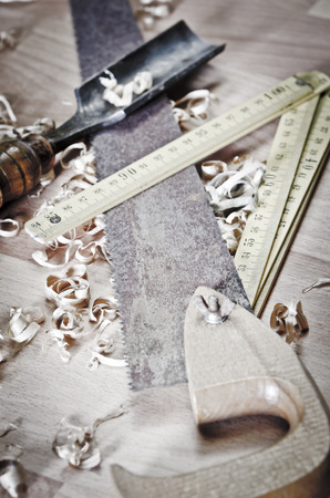 Old carpentry tools on a wooden tableの写真素材
