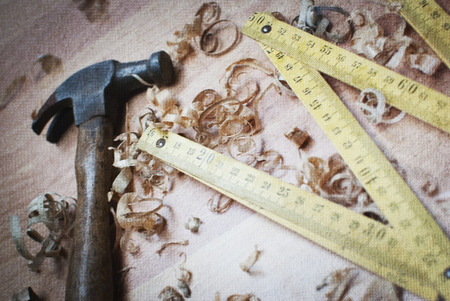 Old carpentry tools on a wooden tableの写真素材