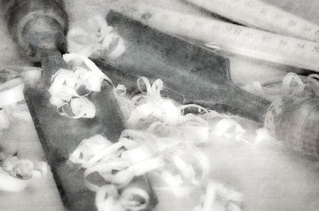 Old carpentry tools on a wooden tableの写真素材