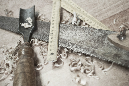 Old carpentry tools on a wooden tableの写真素材