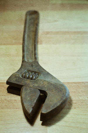 Spanner on a wooden backgroundの写真素材