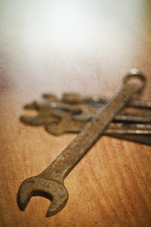 Some spanners on wooden background, studio shot.の写真素材
