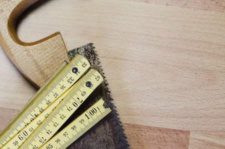 Old carpentry tools on a wooden tableの写真素材