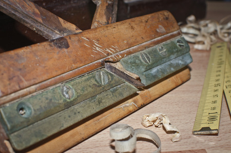 Old carpentry tools on a wooden tableの写真素材