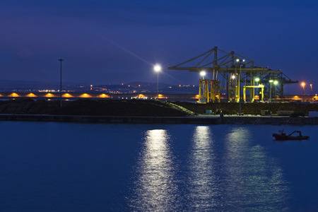Container harbor cranes at night.の写真素材