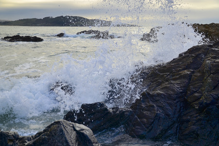 Water waves on rocks at a beachの写真素材