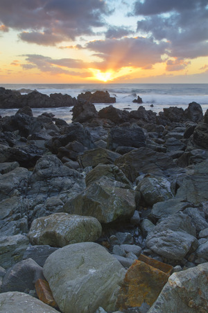 last rays of sunlight over the shoreline - Textured effectの写真素材