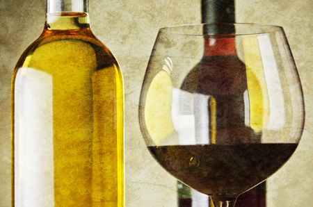 White and red wine bottles and glasses.の写真素材