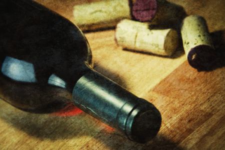 Bottle of red wine with a corkの写真素材