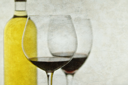 Glasses of red wine and bottle of white wine.の写真素材