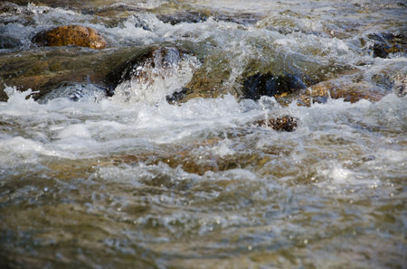 Abstract flowing water river stone curves background