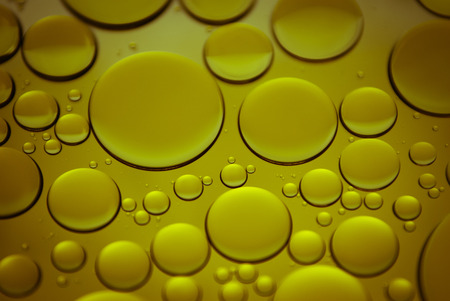 Bubbles of oil in waterの写真素材