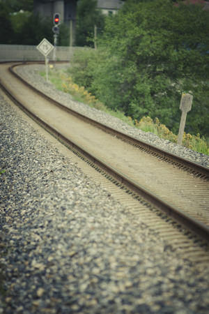 railway tracks in a rural scene with nice pastel sunsetの写真素材
