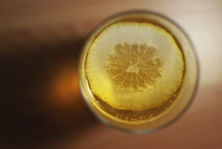 Cup of water with a slice of lemon.の写真素材