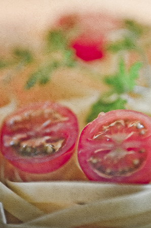 Raw pasta on the wooden table.の写真素材