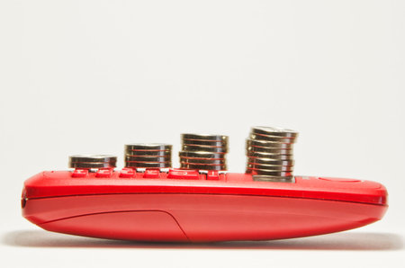 coin stacks on red phone.の写真素材