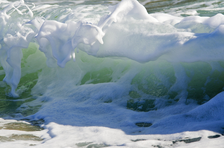 Splash wave on the beach.の写真素材