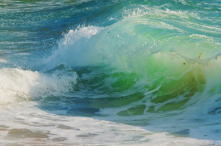 Splash wave on the beach.の写真素材