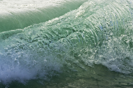 Splash wave on the beach.の写真素材