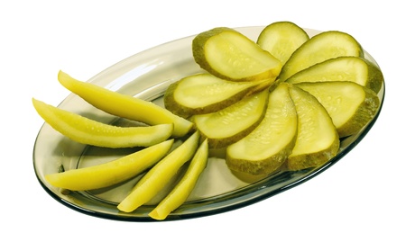 Salt pickles on the plate on a white backgroundの写真素材