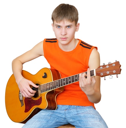 Fifteen year boy with classical Spanish guitar. Isolated on white backgroundの写真素材
