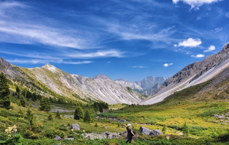 Man and the surrounding nature. The girl in the alpine circus. Freedom of thought and soulの写真素材