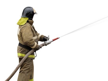 Firefighter working with fog nozzle. Isolated on white backgroundの写真素材