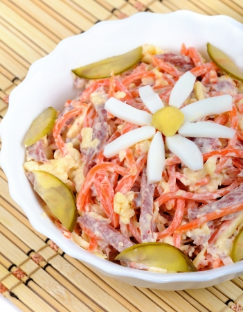 Korean carrot salad with chamomile flower decorated chicken eggsの写真素材
