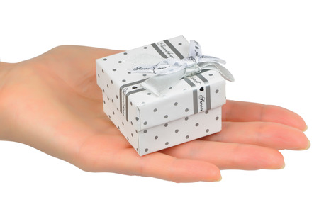 Gift beloved woman in the palm of female handの写真素材