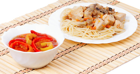 Hot spaghetti and cold appetizer of bell peppersの写真素材