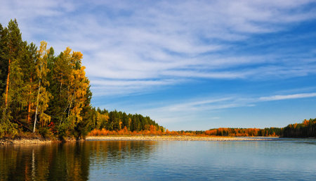 Autumn landscape on the river. Sky, forest and waterの写真素材