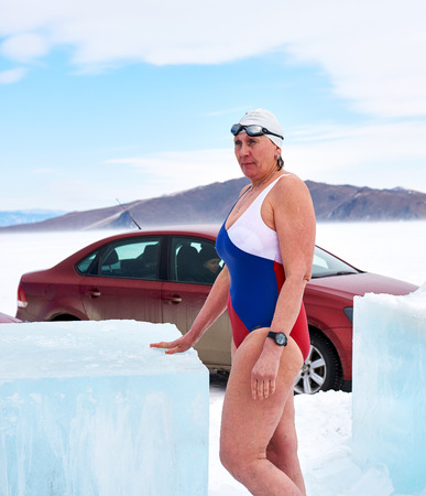 SAHYURTA, IRKUTSK REGION, RUSSIA - March 11.2017: Cup of Baikal. Winter Swimming Competitions. A strong woman is swimmerのeditorial素材