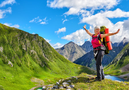 Happy hiker on top of hill in Siberian mountains. East Sayan. Russiaの写真素材