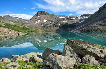 Beautiful water of small lake in Eastern Siberia. Sayan mountains. Republic Tyvaの写真素材