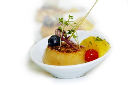 Scallops with orange on white backgroundの写真素材