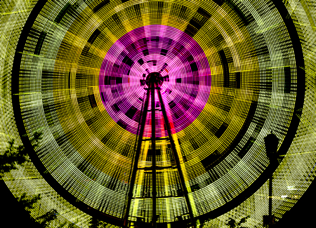 Bright, beautiful Ferris wheel at night on a black backgroundの写真素材