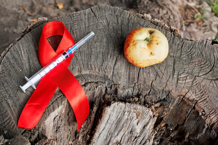 1st December, World Aids Day concept with shiny red ribbon awareness. Health and medicine