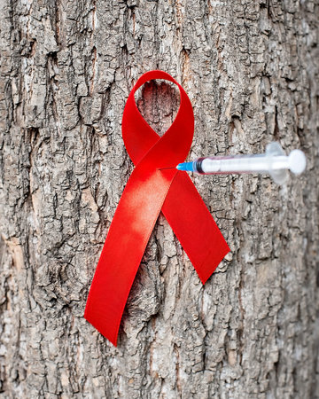 1st December, World Aids Day concept with shiny red ribbon awareness. Health and medicine