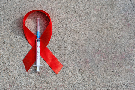 1st December, World Aids Day concept with shiny red ribbon awareness.