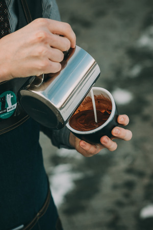 how to make latte art by barista focus in milk and coffeeの写真素材